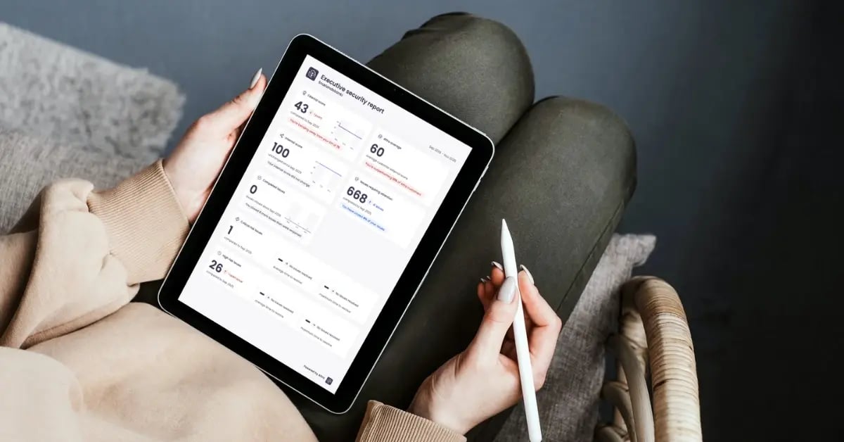 Woman holding an iPad with the Aftra executive report on it