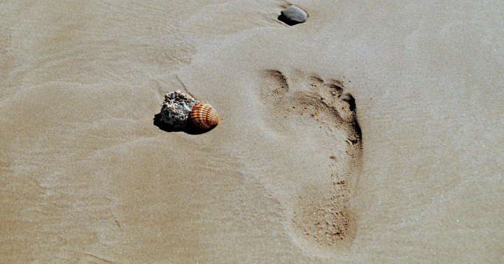 Photo of a footprint in the sand
