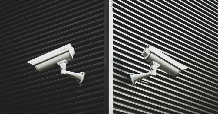 Photo of 2 security cameras on a building