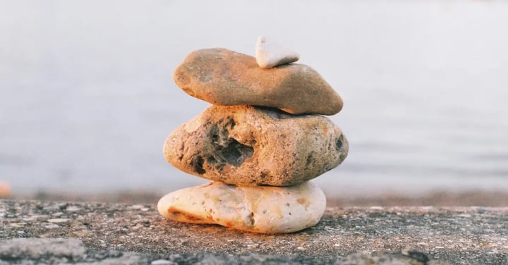 Photo of rocks stacked on a beach