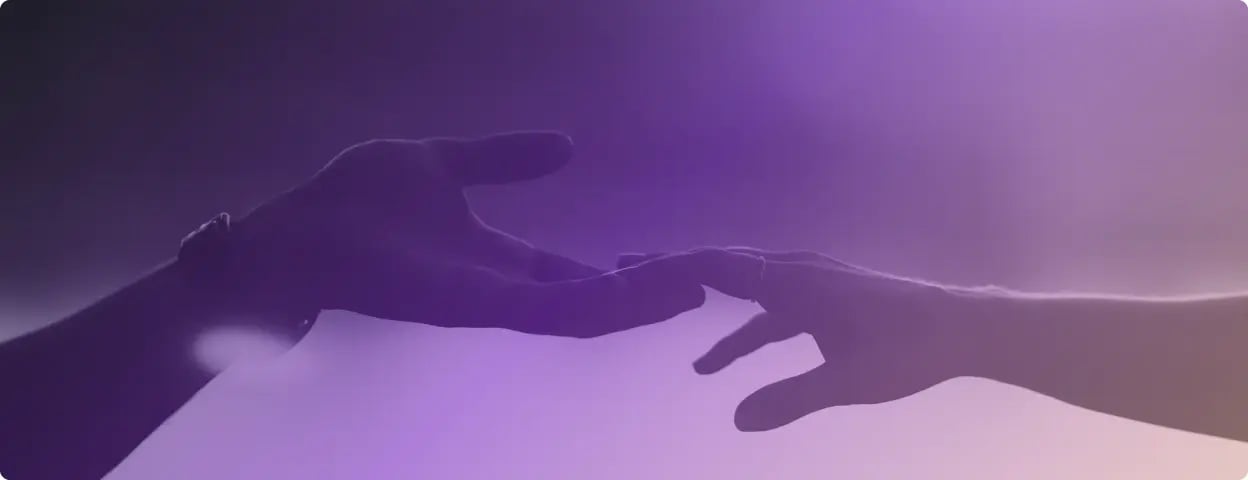 Photograph of hands reaching together with purple gradient filter