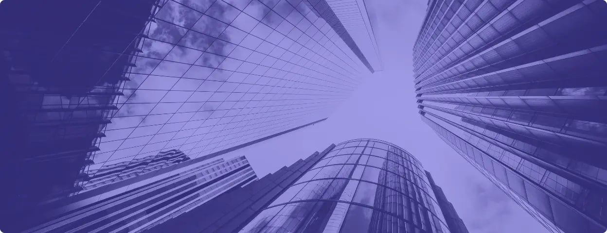 Photo of skyscrapers taken from below with a purple filter