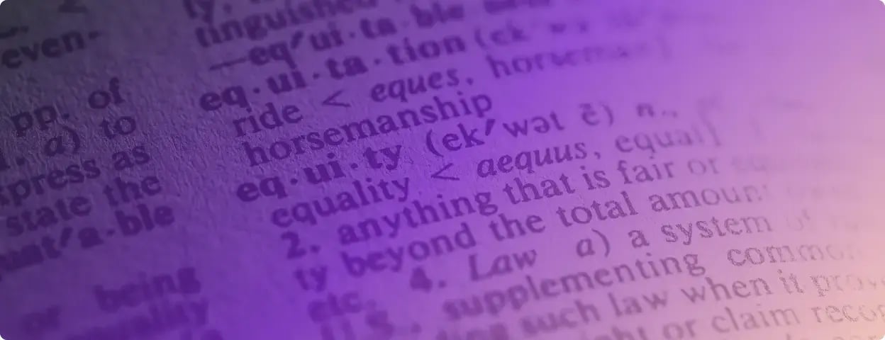 Up close photo of a dictionary page with a purple gradient filter