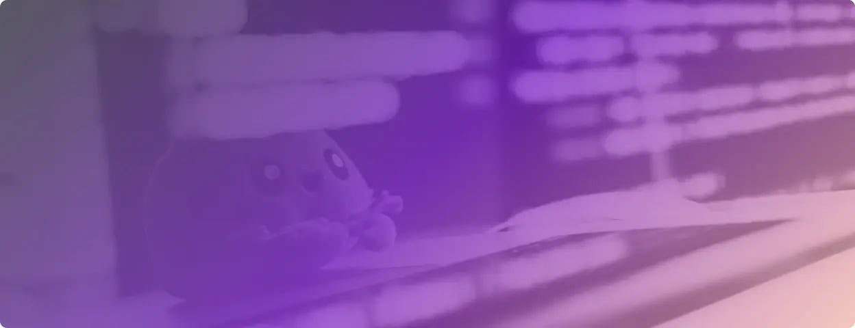 Photo of a toy in front of a laptop with purple gradient filter