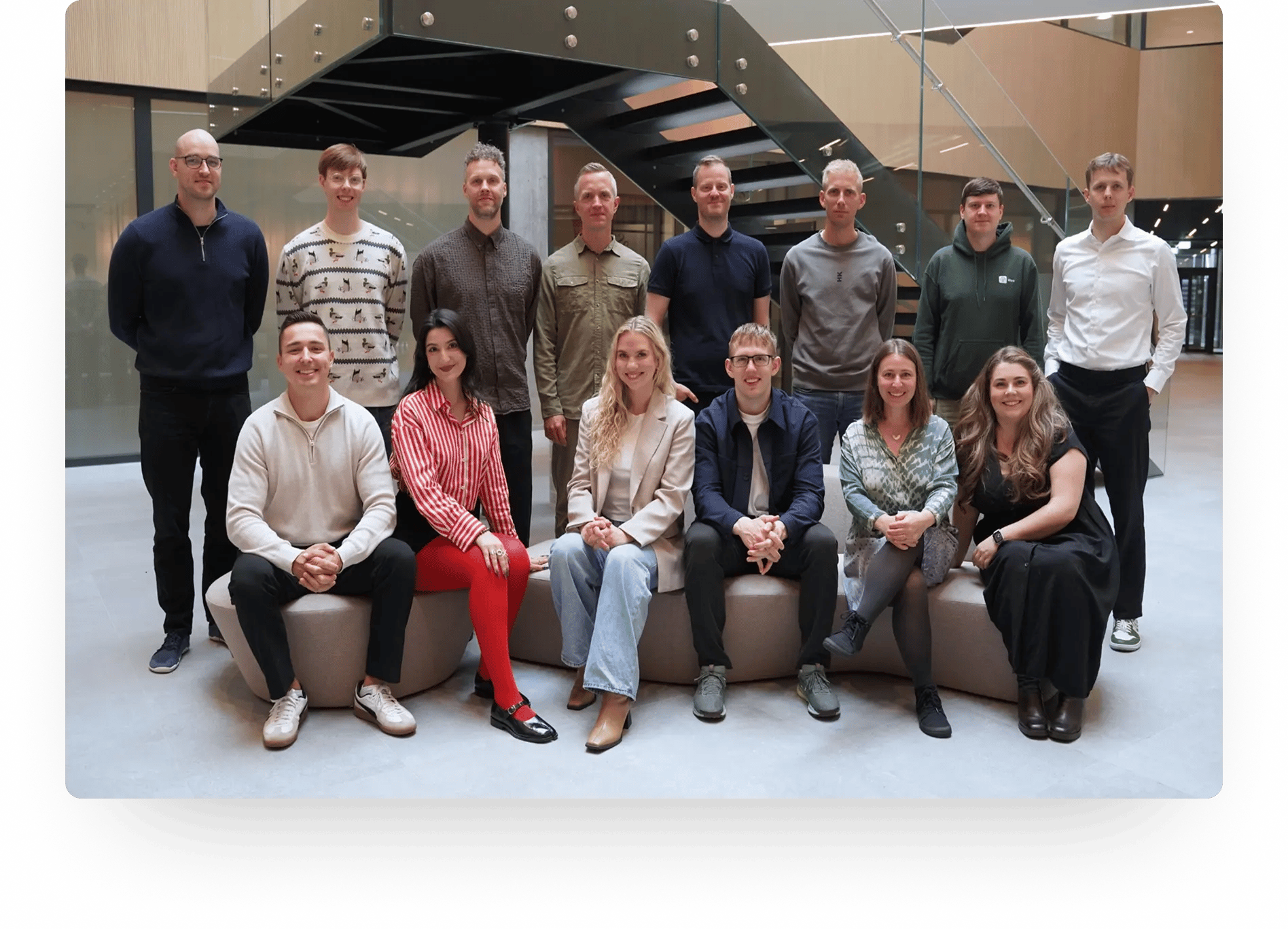 Photograph of the Aftra team on a sofa in office hallway