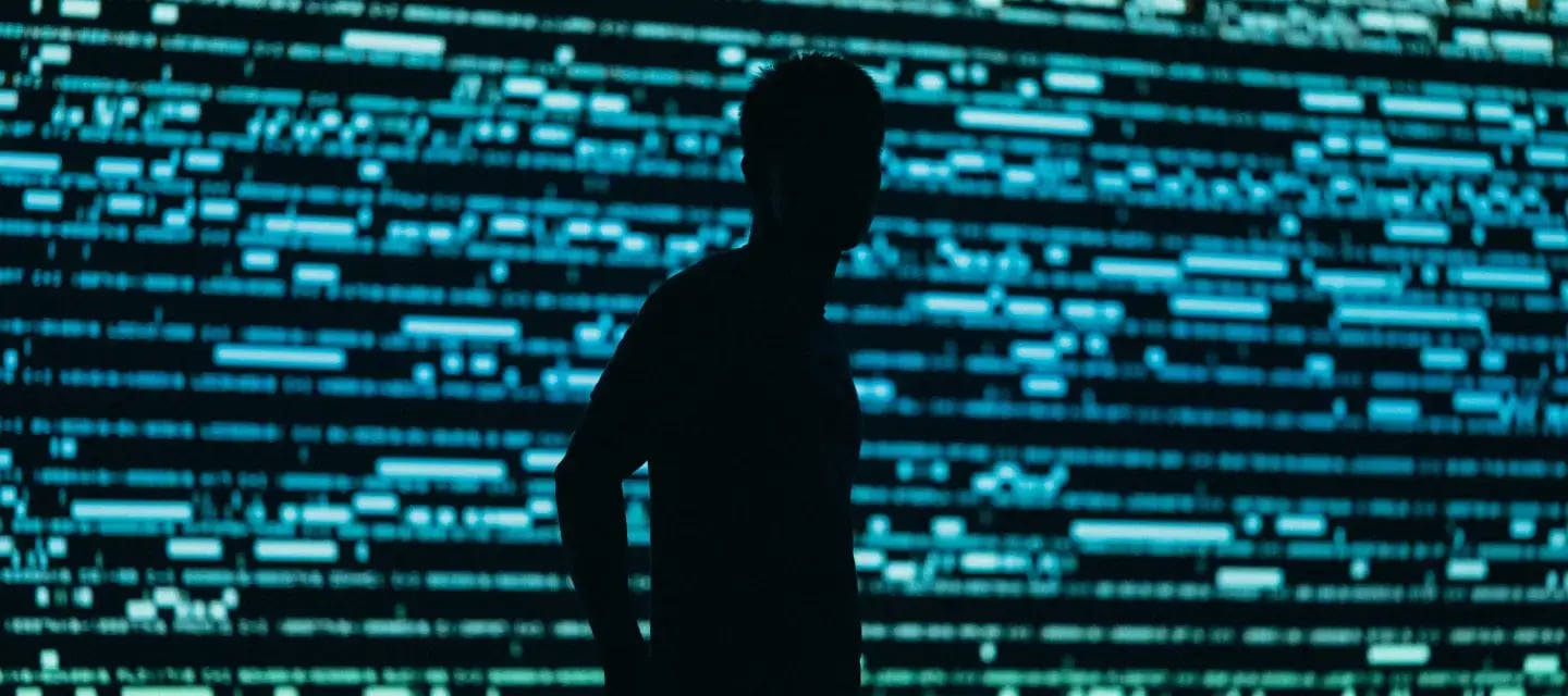 human silhouette and screen in background